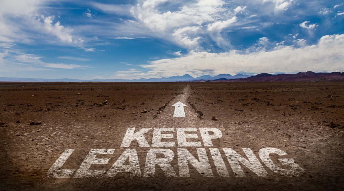 Keep Learning written on desert road